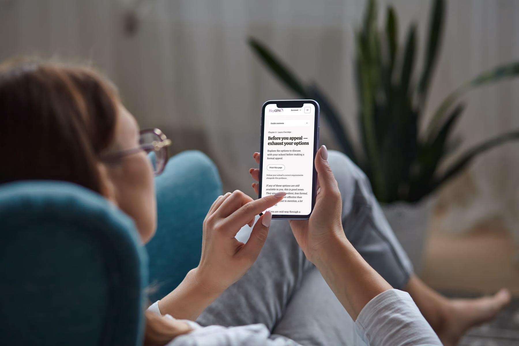 Someone reading Chapter 2 of the Guide on a phone